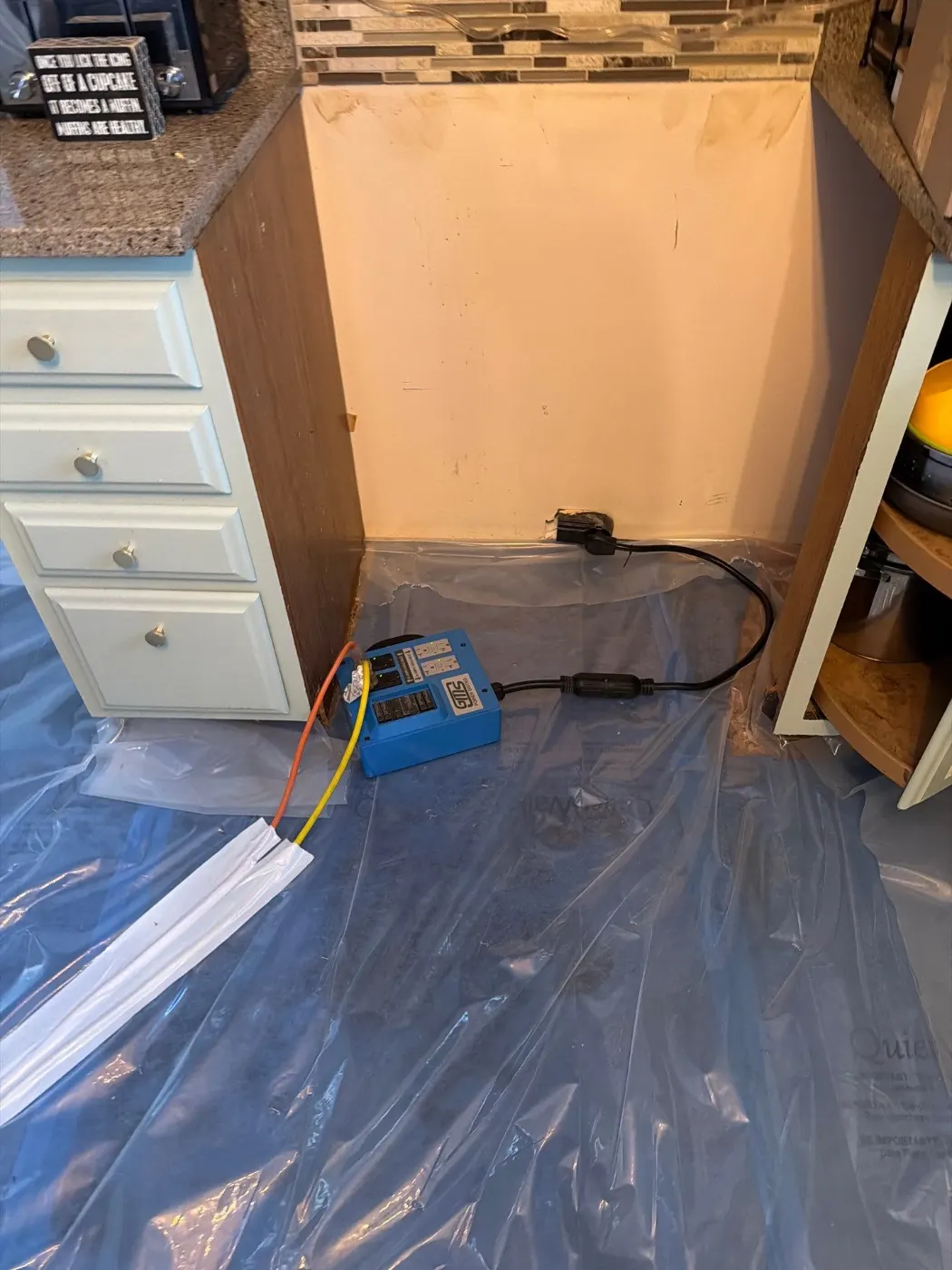 Moisture meter reading on drywall in Meridian-Kessler water loss
